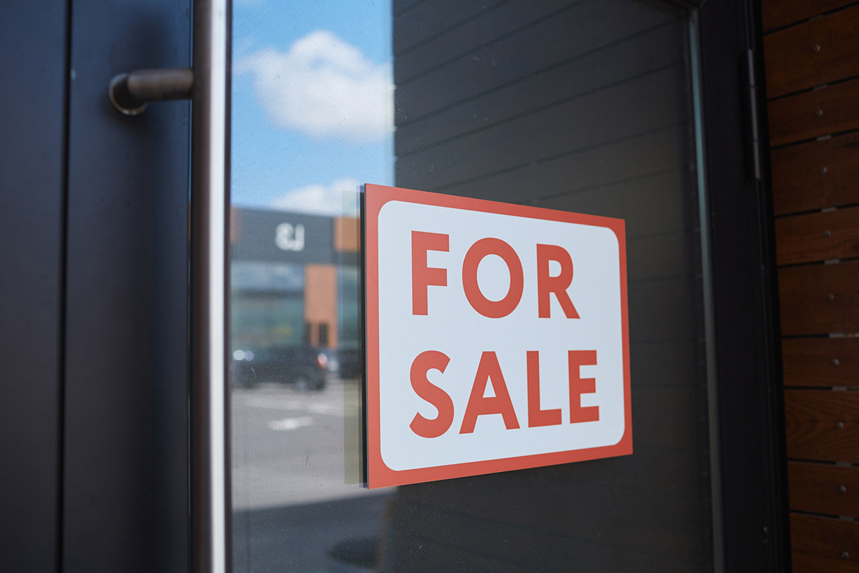 For sale sign on building door